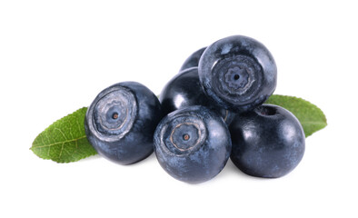 Delicious ripe bilberries and green leaves isolated on white