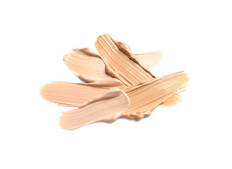 Samples of skin foundation on white background, top view