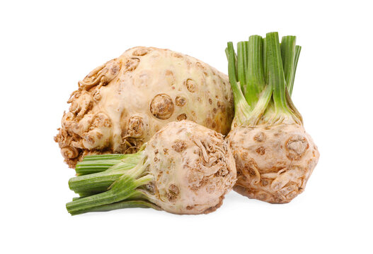 Many raw celery roots isolated on white