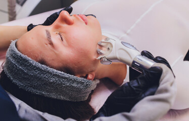 Lymphatic drainage massage LPG apparatus process. Therapist beautician makes a rejuvenating facial...