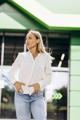 Young woman standing outside office building