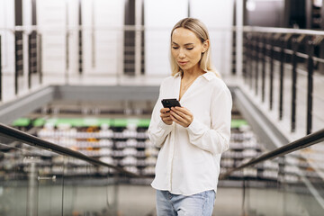 Woman talking on the phone at the building material market