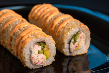 Japanese sushi rolls with cheese close-up.