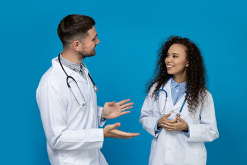 Male and female doctors in white uniform