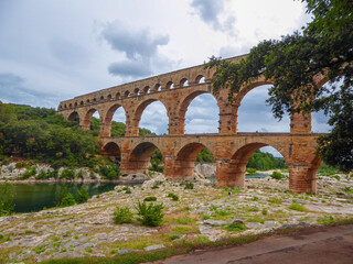 Panoramic view of ancient old Roman Aqueduct Pont du Gard ear Vers-Pon-du-Gard, Occitanie, France,...