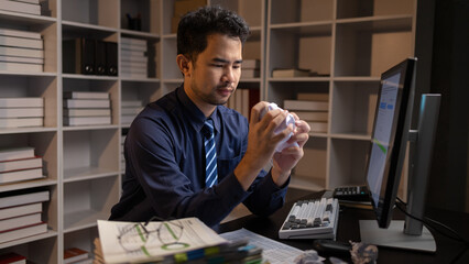 Startup company employees work overtime and work hard causing stress and fatigue from work, office...