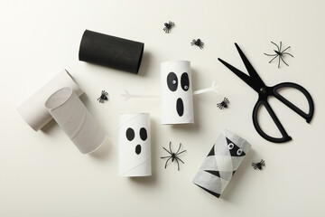 Fototapeta na wymiar Ghosts mockups and spiders on white background, top view