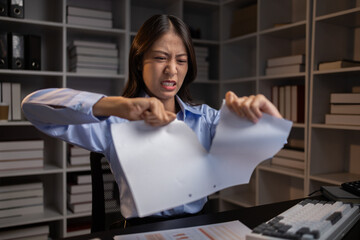 Company employees working overtime after work, working overtime after working hours due to heavy...