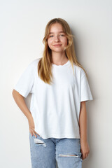Fototapeta premium Portrait of young beautiful cute teen girl posing at camera