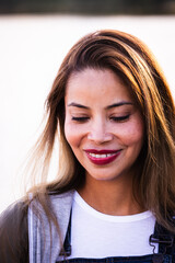 Beautiful asian young woman smile and cheerful. Confident cute female looking down, away from camera relax and happiness with wellness life. good moment and positive emotional. Happy woman enjoy her