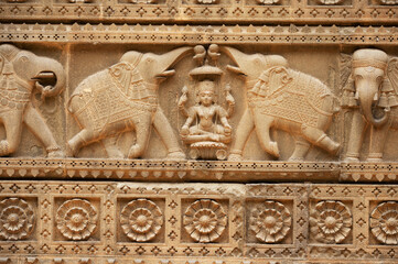 Carving details on the outer wall of Shri Ahilyeshwar Mandir, situated in Ahilya Devi Fort complex on the banks of River Narmada, Maheshwar, Madhya Pradesh, India