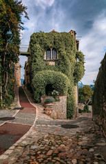 Traditional old stone house with jasmine vines where the French poet Jaques Prevert lived in the...