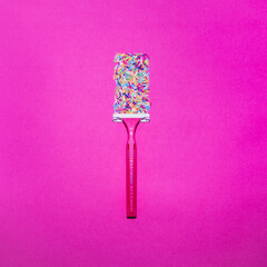 The razor leaves a trace in the form of a colored sprinkle. Total pink, flat lay, top view - 640221066