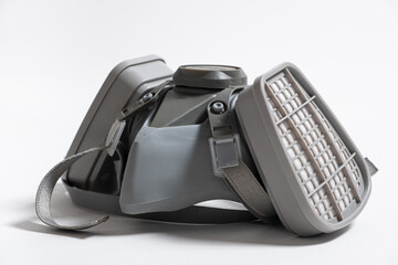 Respirator with dust and gas filters on a white background.