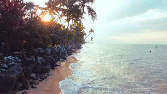 Tropical drone footage at sunset at Bang Por Beach in Ko Samui Island, Thailand