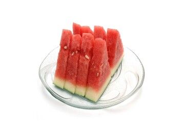 red watermelon slices on a glass plate on a white isolated background