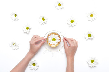Flowers composition. Wreath made of various yellow flowers on white background. Easter, spring, summer concept. Flat lay, top view.