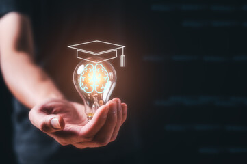 Man holding lightbulb showing graduation hat, Internet education course degree, knowledge creative...