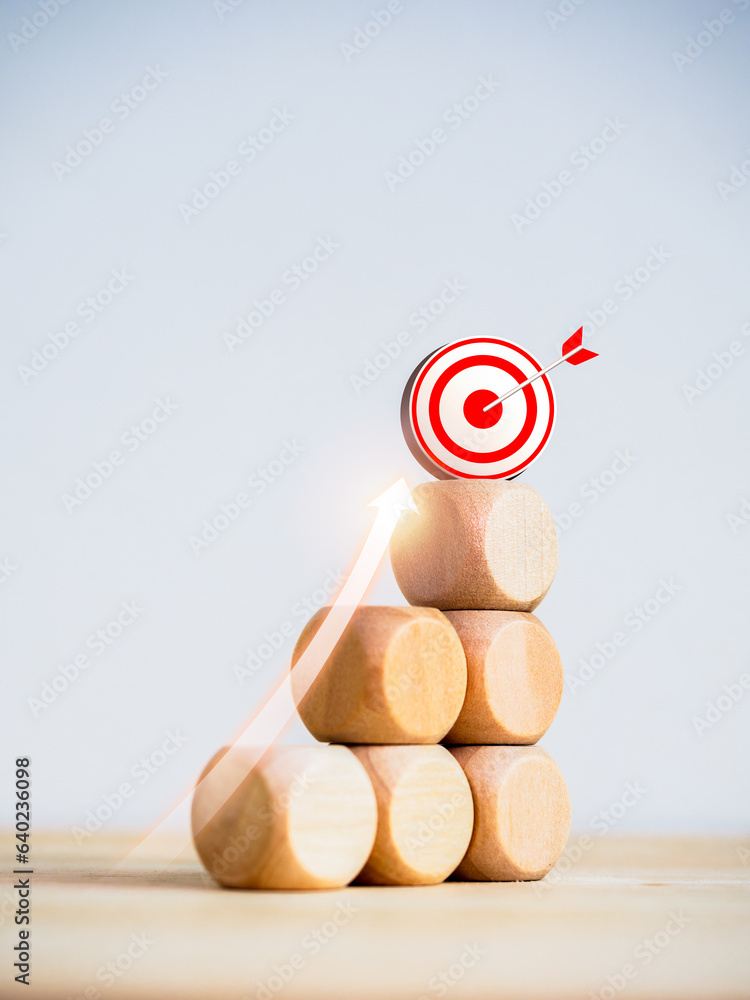 Aufkleber 3d target icon on top of wooden blocks with rise up arrows on bar graph chart steps on white backgro