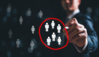 Human resource management, HR, recruitment, leadership and team. Business and technology concept, Marketing target audience concept, Businessman writing red circle to mark to focus customer group
