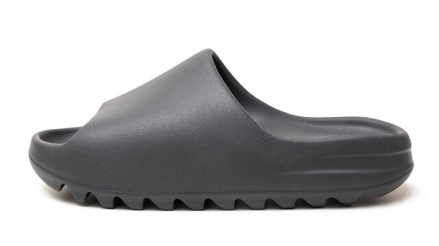 single Adidas Yeezy Slide, isolated white background. Milan Italy_August 25 2023