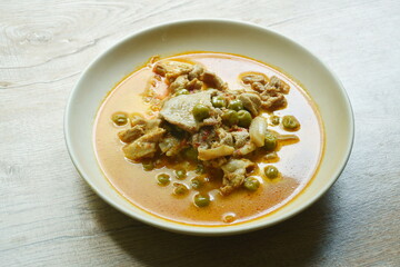 pork curry with eggplant in coconut milk or Phanaeng Thai food on plate