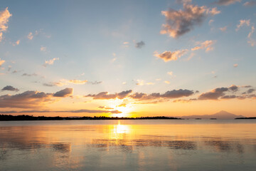 Beautiful nature with sunrise on the beach and sea or ocean.  Nature composition.