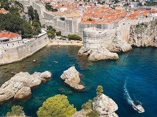 Enchanting Croatian coast: turquoise sea, bays, ships, and vibrant coastal houses