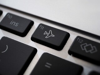 Black Burton airplane mode or  flight mode on a keyboard