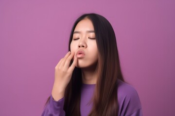 Fototapeta premium Young Asian woman got sick and flu on purple background isolated