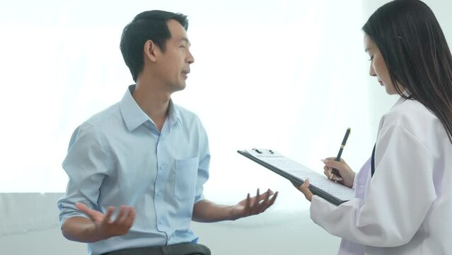 4k slow motion of female doctor specialist and male patient Office Syndrome refers to a group of various symptoms including the inflammation of neck, shoulder and back muscles. muscle strain