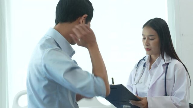 4k slow motion of female doctor specialist and male patient Office Syndrome refers to a group of various symptoms including the inflammation of neck, shoulder and back muscles. muscle strain