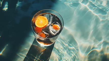  Fresh cocktail with lemon tea next to swimming pool in summer vacation under sunshine © wcirco