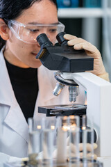 Closeup of Scientific microscope data analysis in the laboratory, medicine equipment setting in lab for chemistry or science research technology discovery, biotechnology or biology tool for study