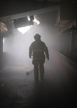 Firefighters In A Smoky Building