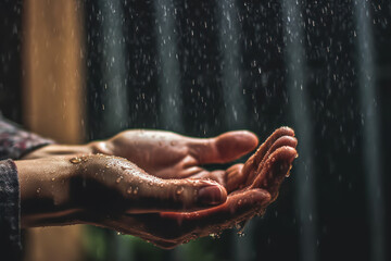 Fototapeta na wymiar Human hands with water splashing on them.