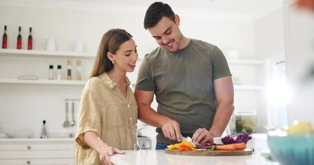 Food, nutrition and a couple cooking in the kitchen of their home together for a health recipe. Diet, love or smile with a man and woman preparing supper with vegetables for wellness or hunger