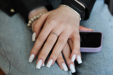beautiful female hands with light manicure.