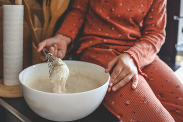 Kneading dough for pancakes, cooking homemade breakfast