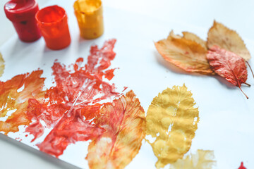Children's autumn activity, leaf print on paper