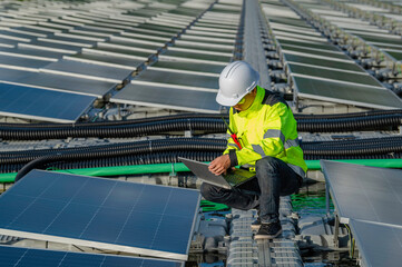 Asian engineer working at Floating solar power plant,Renewable energy,Technician and investor solar...