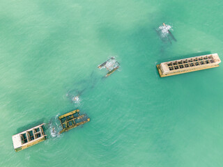 Aerial view of the old remains of the bridge which was used on the D-Day beaches in Normandy during second world war. 