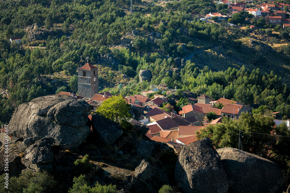 Sticker view of house and chapel near a huge boulder in the medieval village of monsanto, portugal.