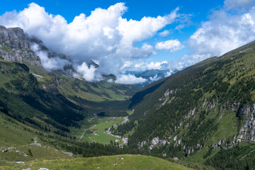 Valley in Alps on blue sky