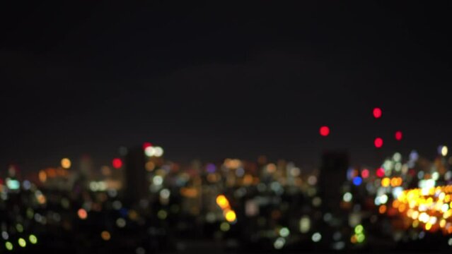Blurred of night city skyscraper and tower lights bokeh , Soft Focus , Metropolis Backgound wallpaper for movie or documentary romantic mood concept 