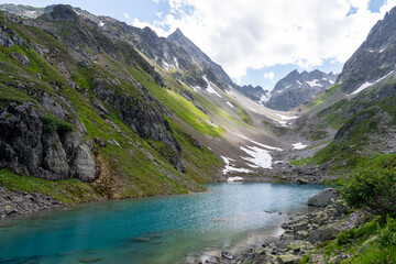 Turquoise blue Mountain lake in the swiss alps in Kanton uri - obrazy, fototapety, plakaty