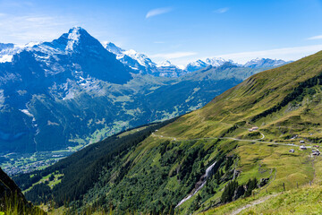 Fototapeta na wymiar View of the Valley and Mountains surrounding Grindelwald with the Eiger rising in the background 