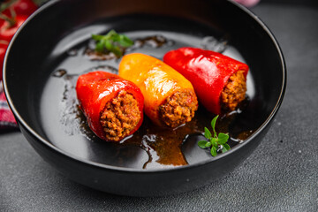 stuffed pepper meat stuffing bell pepper paprika pork, beef, chicken meat second course meal food snack on the table copy space food background rustic top view 