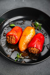 stuffed pepper meat stuffing bell pepper paprika pork, beef, chicken meat second course meal food snack on the table copy space food background rustic top view 