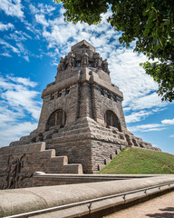 monument to the battle of the nations in Leipzig, Saxony, Germany at daytime against cloudy sky,...